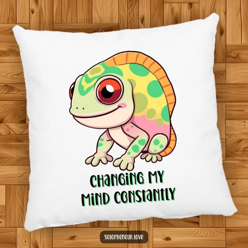 Funny chameleon pillow featuring a smiling character known for rapid color changes, offering comfort and humorous visual appeal.