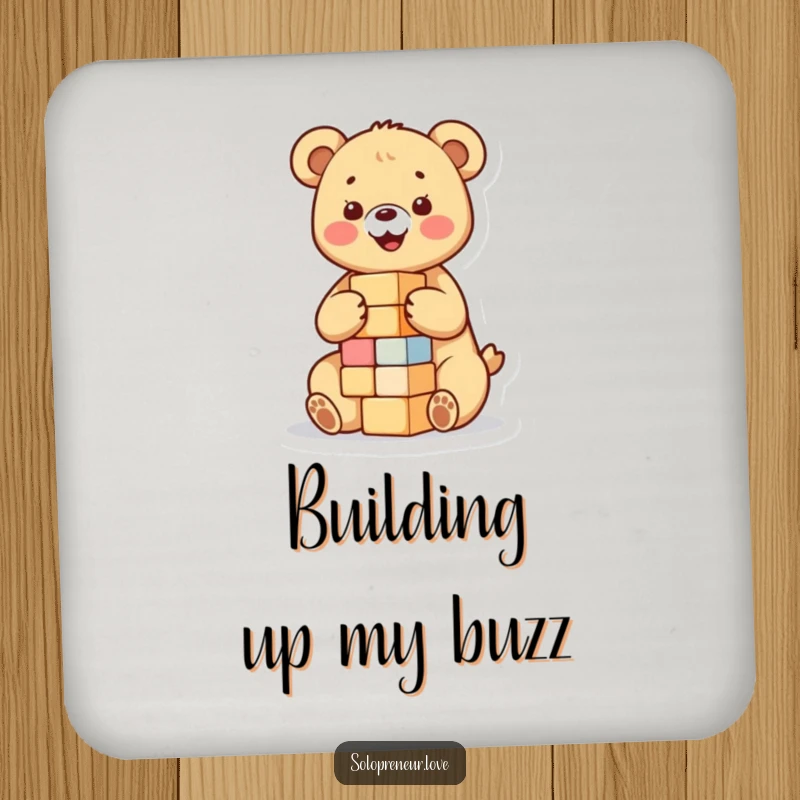 Funny drink coaster featuring a happy bear cub building a small tower of blocks, perfect for protecting surfaces with a touch of playful innocence.