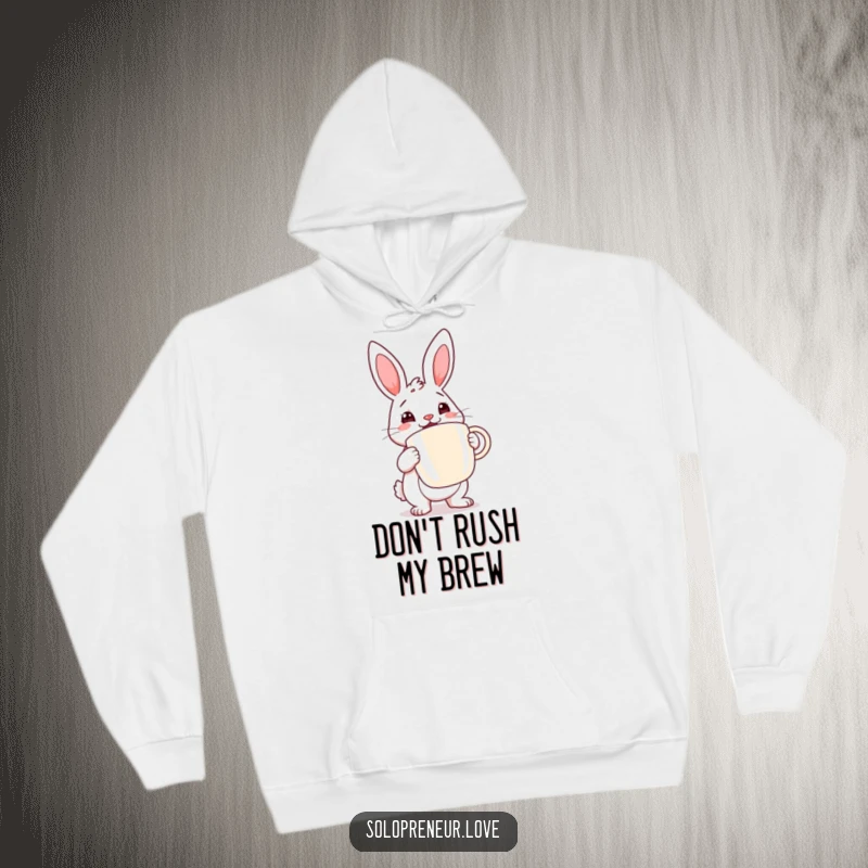 Funny rabbit coffee hoodie with a determined rabbit cheerfully holding a large coffee cup, offering comfort and caffeine vibes.