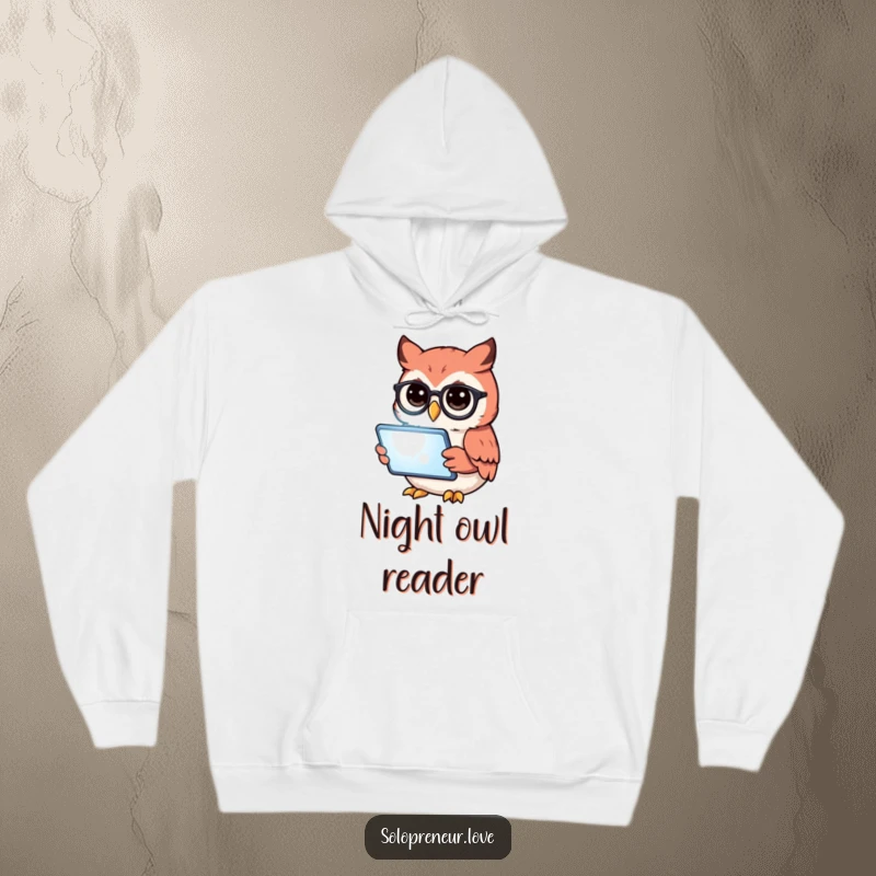 Funny owl character in glasses engrossed in a glowing tablet, featured on a cozy hoodie for smarty-pants.