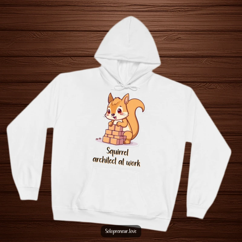 Funny determined squirrel character focused on building with blocks, wearing a tool belt, featured on a cozy hoodie.