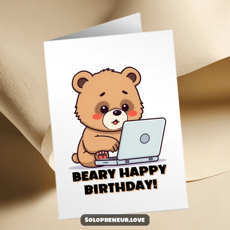 Funny Free Printable Birthday Card: A determined bear cub typing enthusiastically on a laptop, working hard.