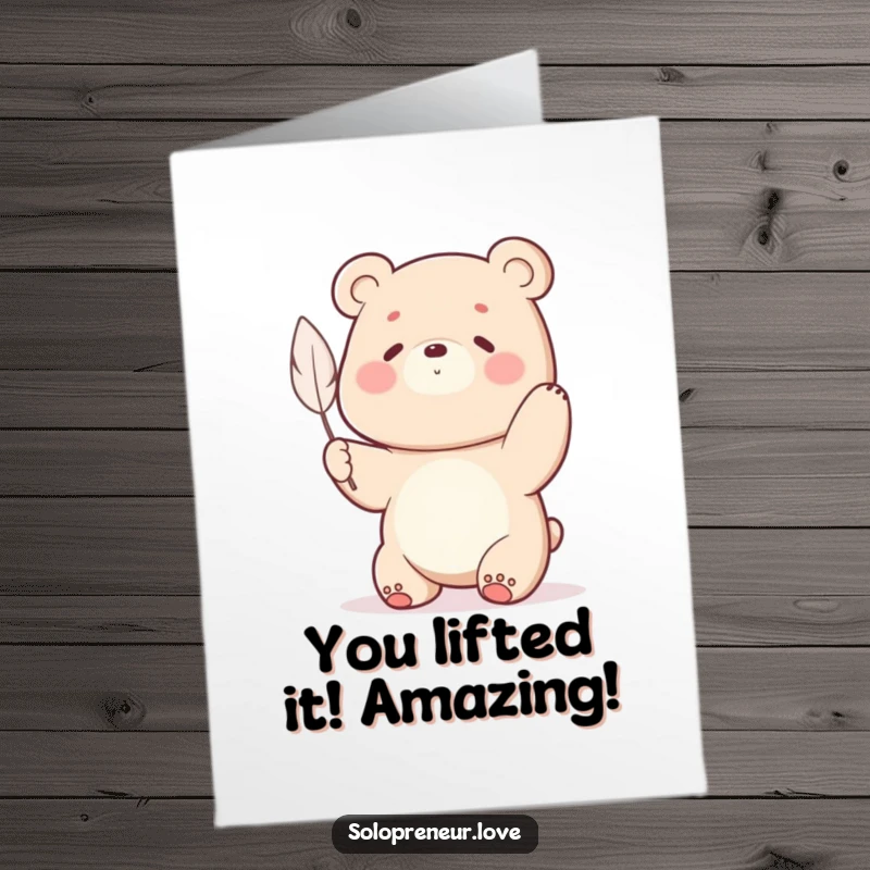 Funny Free Printable Congratulations Card with a bear character intensely straining to lift a single, impossibly light feather.