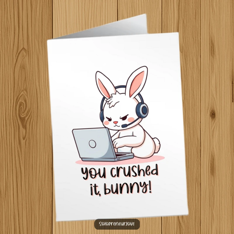 Free Printable Congratulations Card: A determined rabbit character wearing a tiny headset types furiously on a laptop.