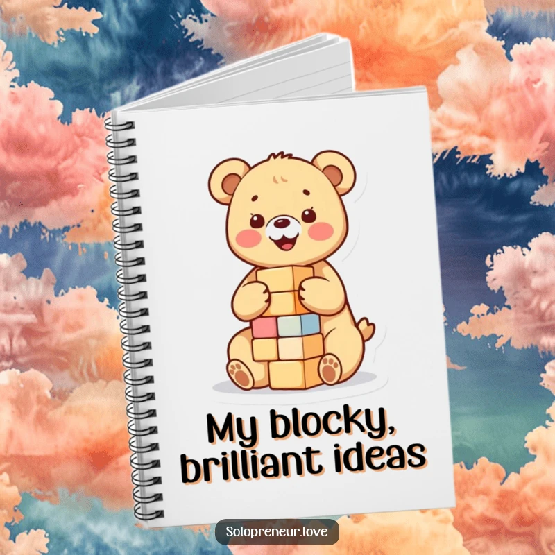 Funny notebook featuring a happy bear cub building a small tower of blocks, perfect for jotting down ideas with a theme of creativity.