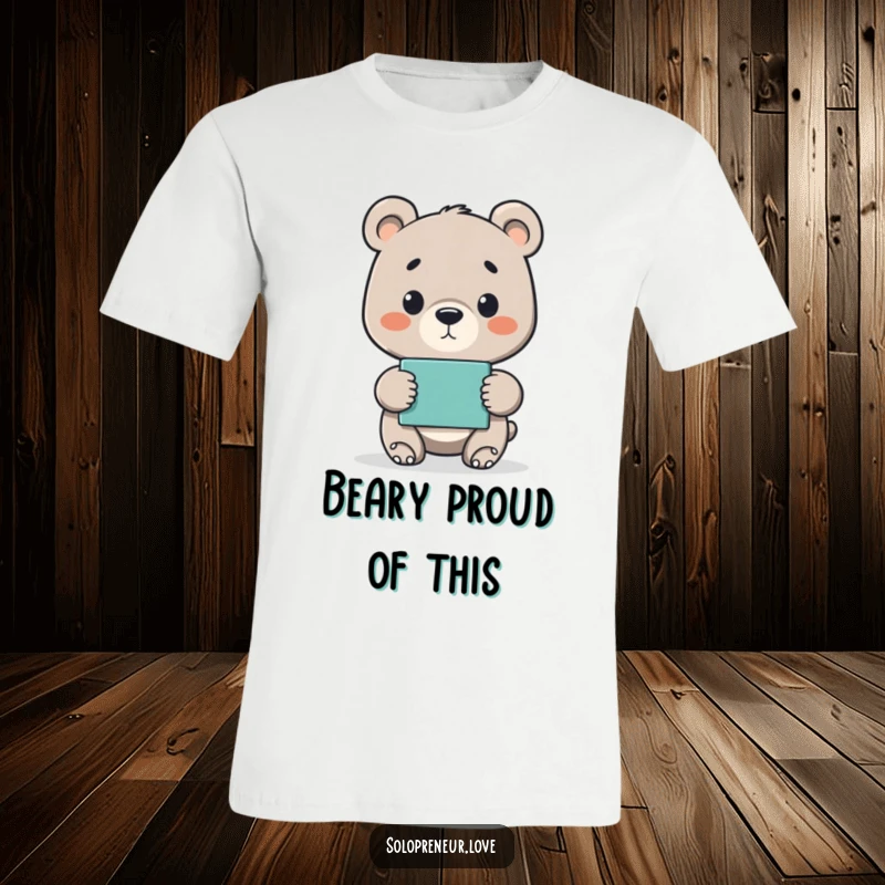 Funny t-shirt featuring a proud bear cub proudly presenting a finished project, celebrating success and diligence.