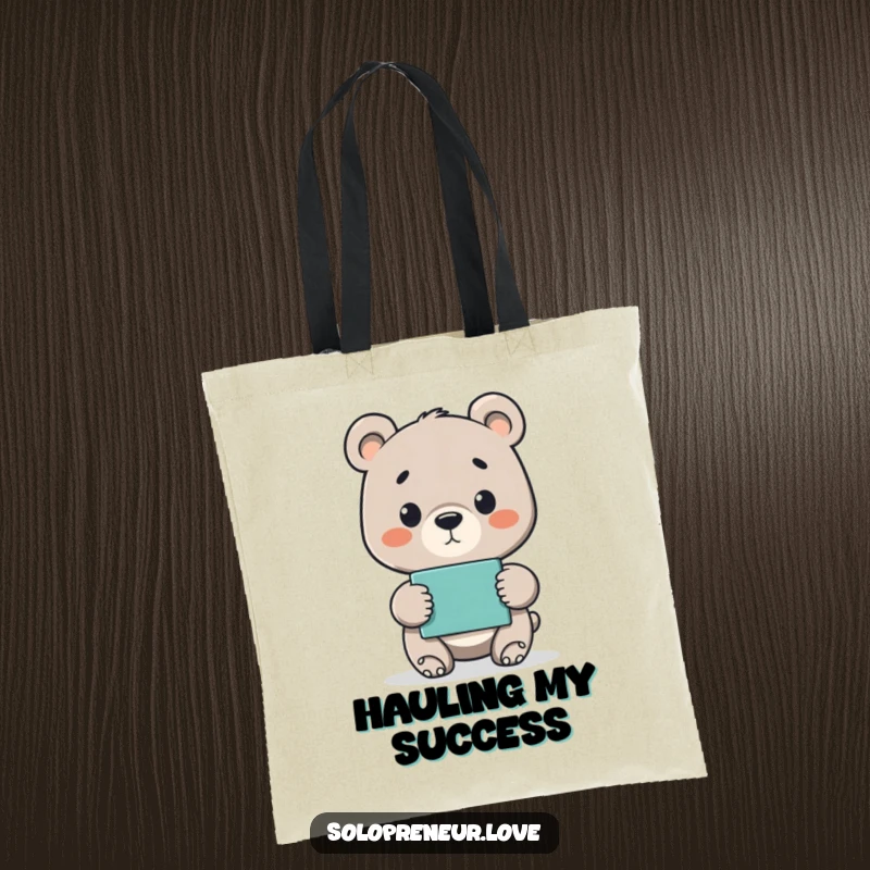 Funny tote bag featuring a proud bear cub holding up a finished project, symbolizing accomplishment and hard work.