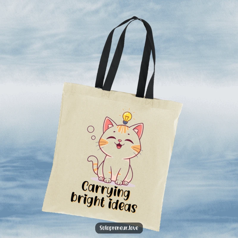 Funny Tote Bag: A playful cat character suddenly has a lightbulb moment, symbolizing a brilliant idea.
